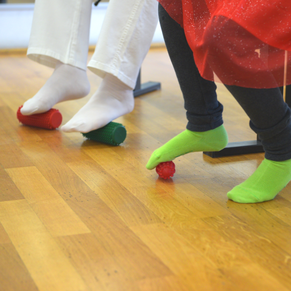 Practicing the viola using the textured massage rollers for the feet